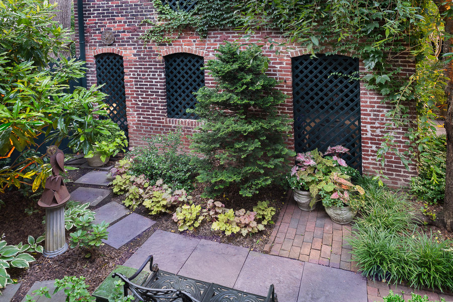 Colorful, low maintenance perennials and evergreen bushes provide interest all year.