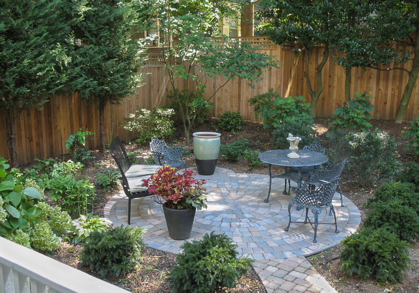 This round patio and small path provide a restful view from the house and a private space to entertain friends.